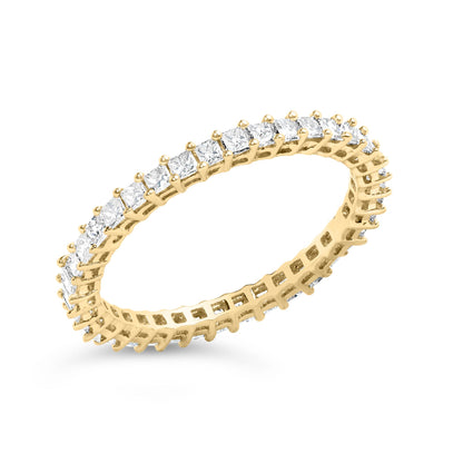 Close-up angled shot of a yellow ring set with square white gemstones in prong settings, shown on a white background.