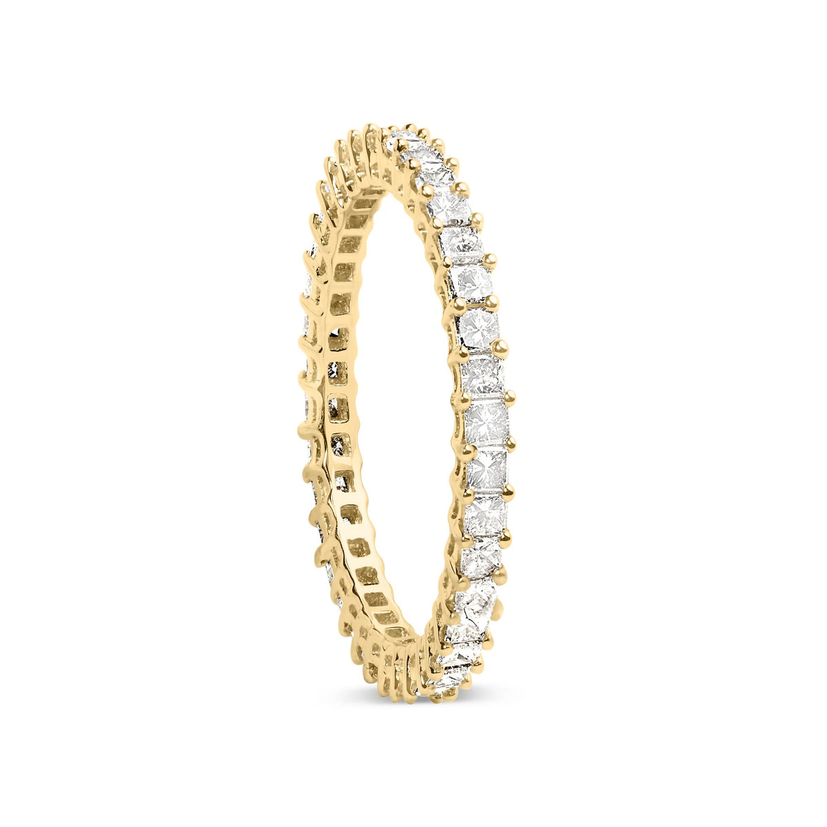 Close-up angled view of a yellow ring featuring a continuous row of prong-set white princess-shaped gemstones, shown standing upright.