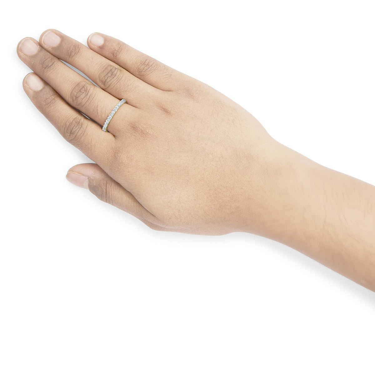 Yellow ring with white princess-shaped gemstones in prong setting, shown worn on a model's finger from a top angle.