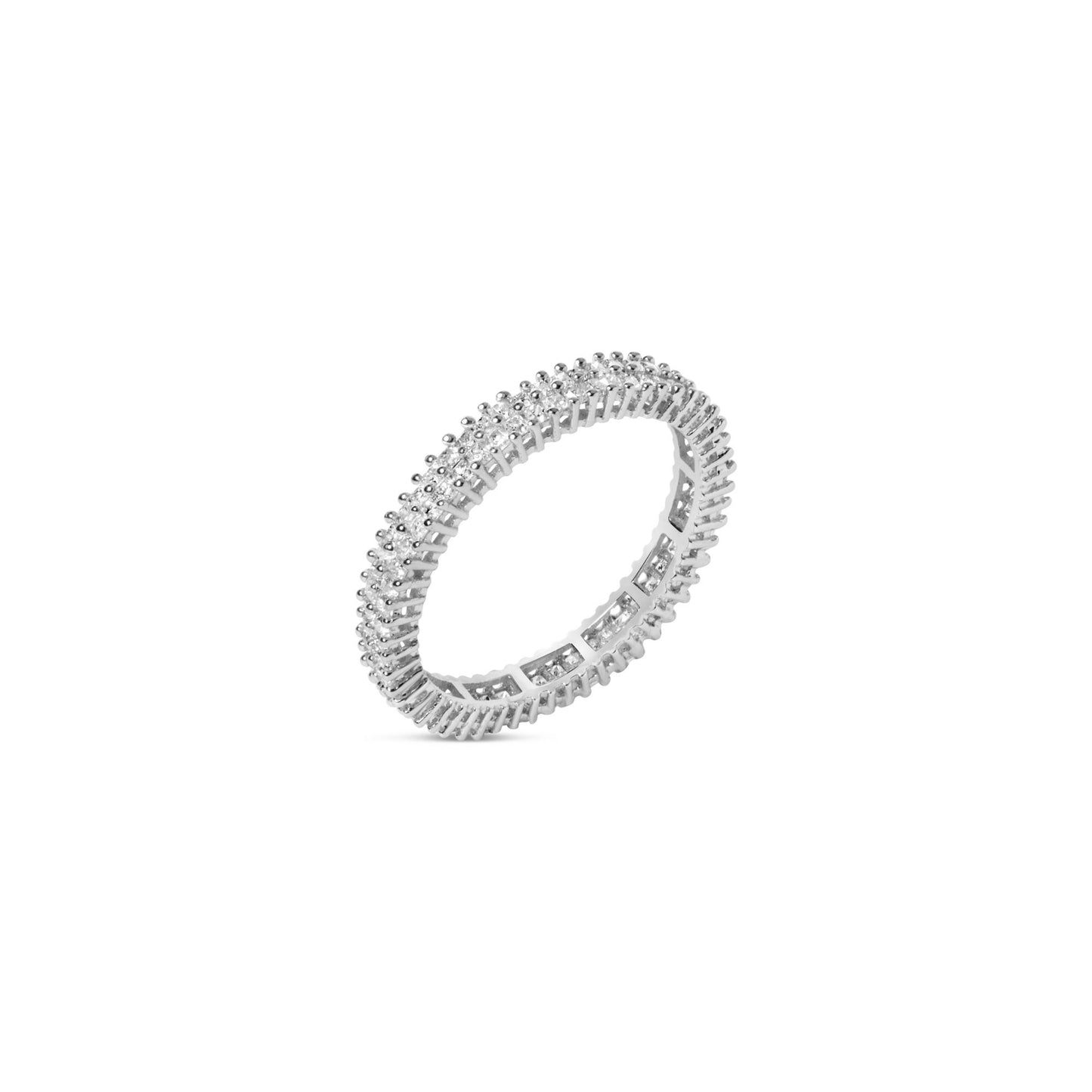 Close-up angled view of a white metal ring featuring princess-shaped white gemstones in a prong setting encircling the entire band.