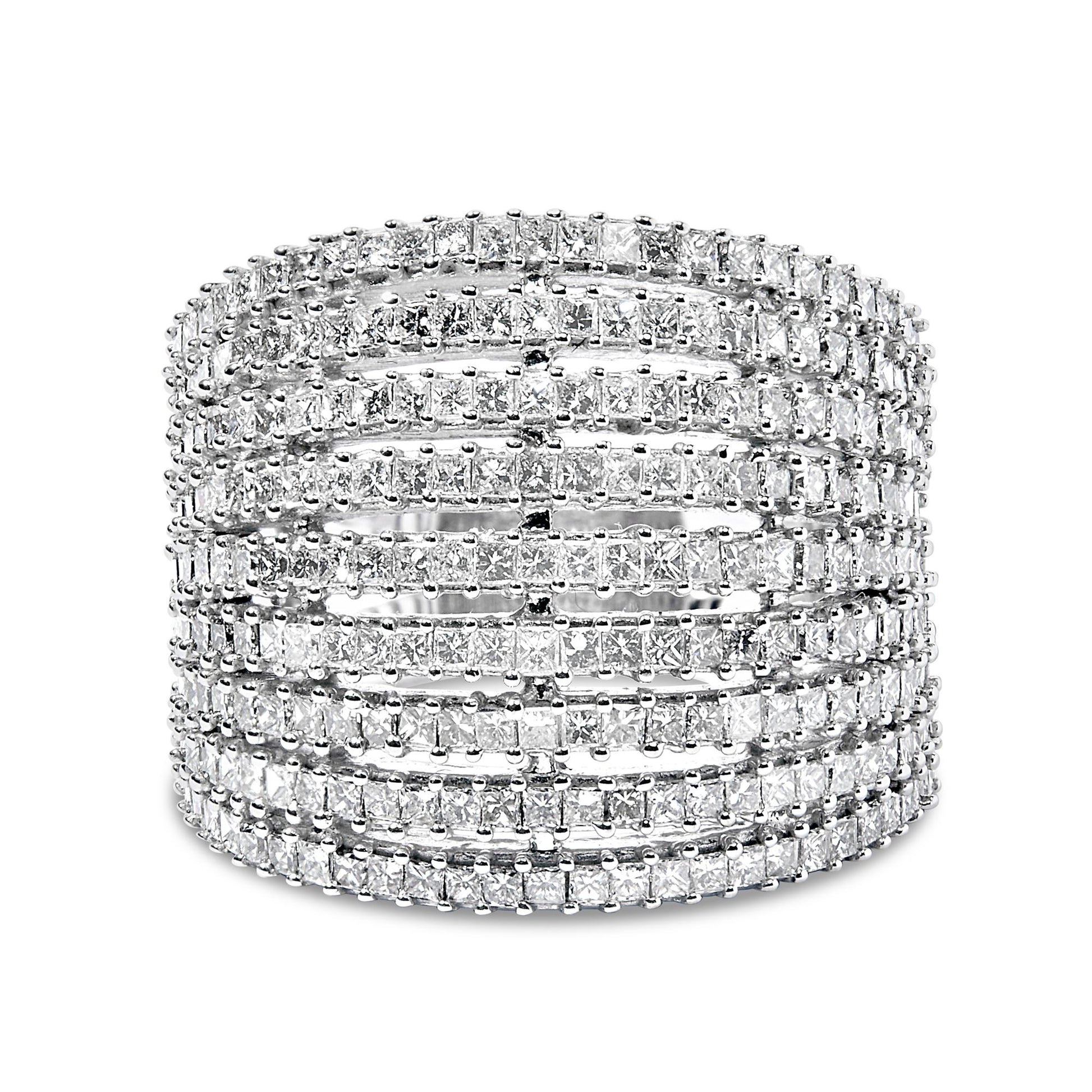 Front-facing view of a white ring featuring multiple rows of princess-shaped white gemstones in shared prong settings.