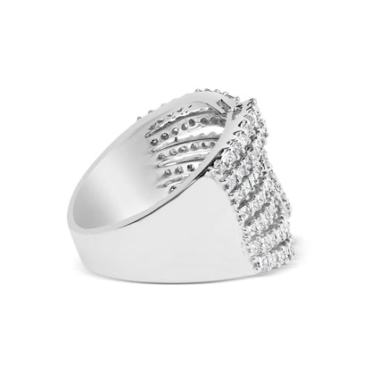Side view of a white metal ring featuring rows of princess-shaped white gemstones in an invisible setting and round-shaped white gemstones in prong settings on the top front.