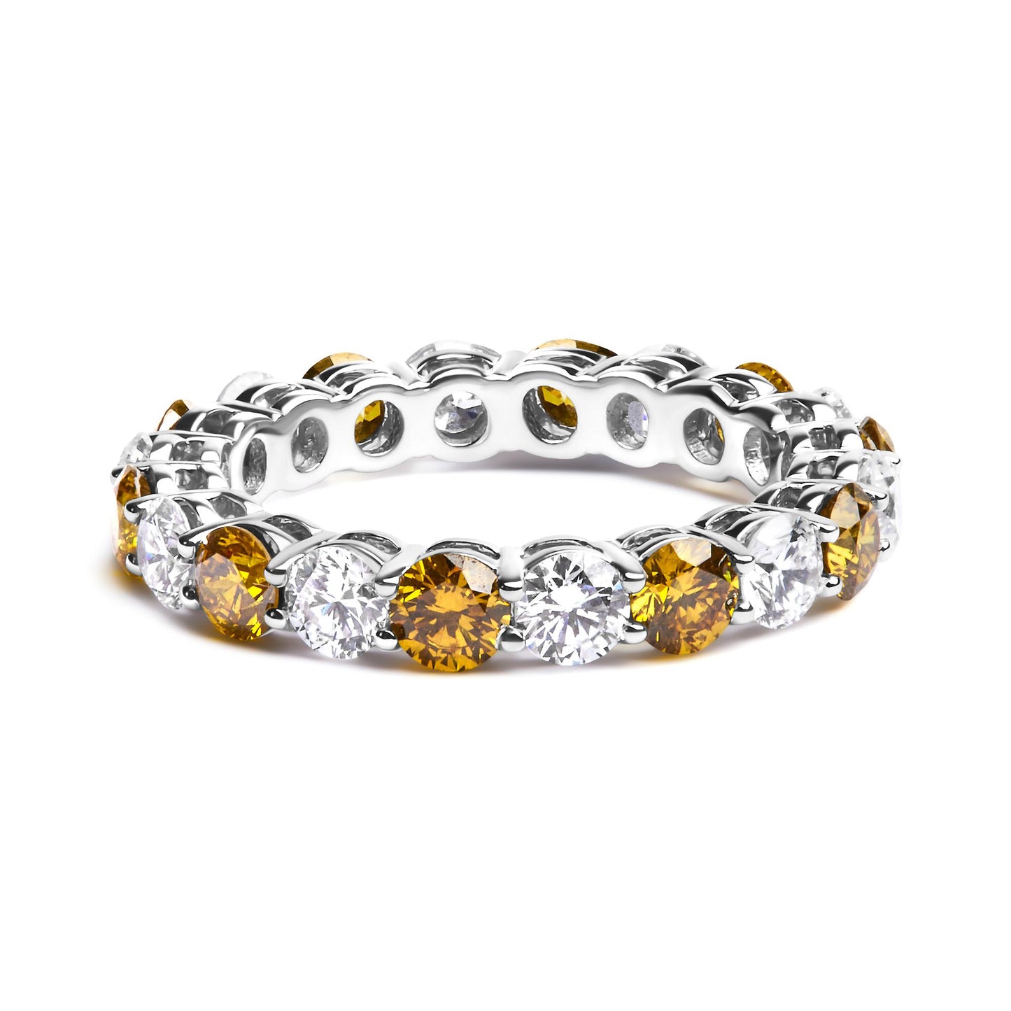 White metal ring with alternating yellow and white round gemstones in prong settings, shown at a slight angle on a white background.