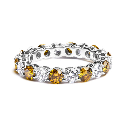 White metal ring with alternating yellow and white round gemstones in prong settings, shown at a slight angle on a white background.