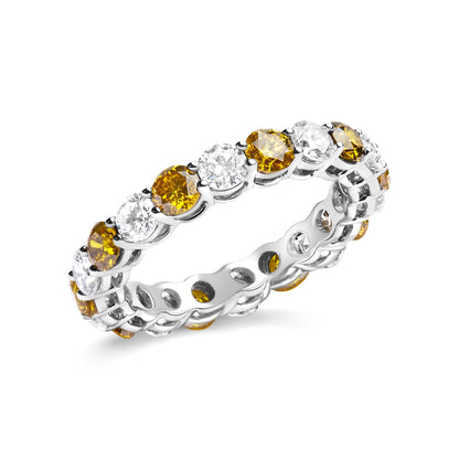 White metal eternity ring with alternating round yellow and white gemstones in prong settings, shown at an angled close-up.