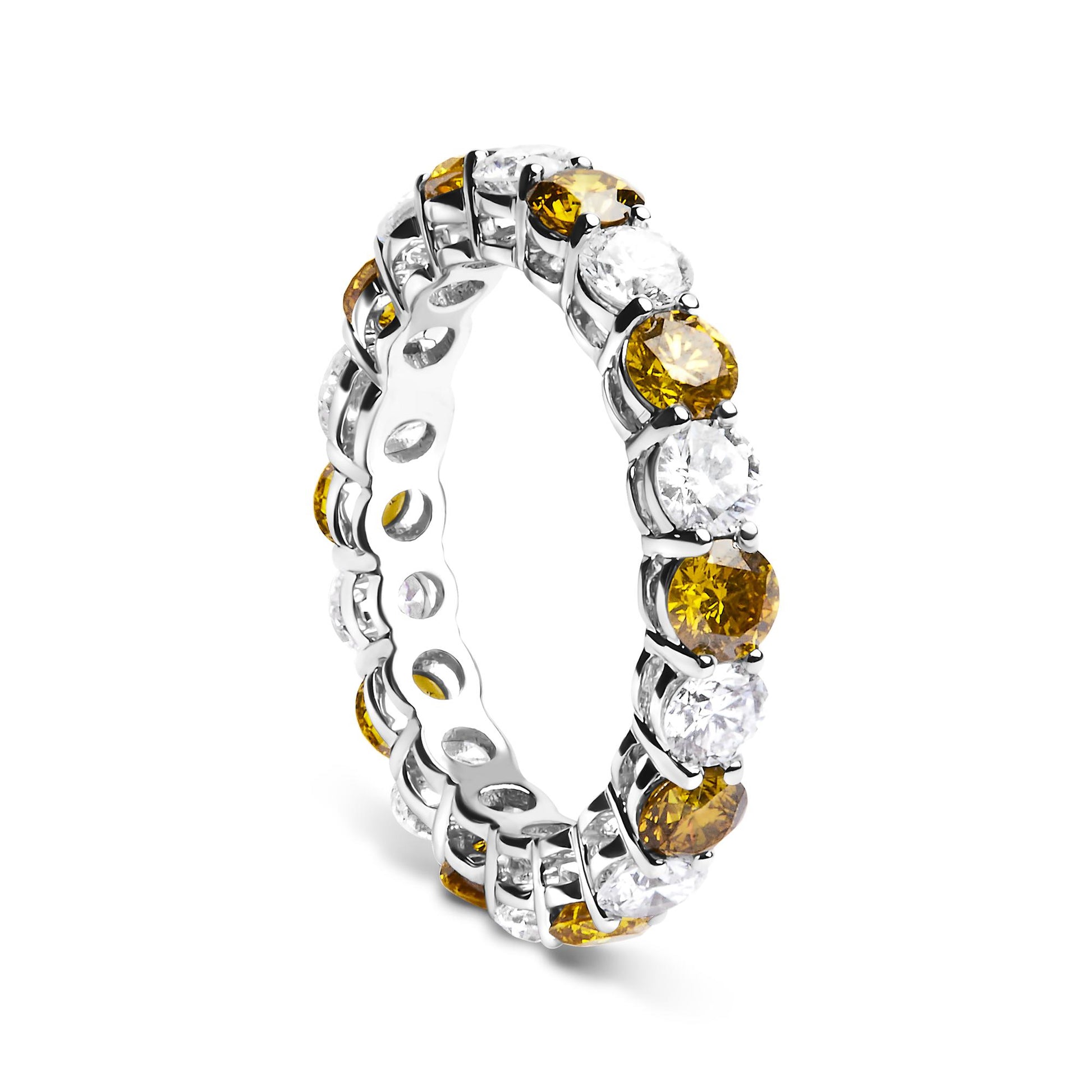 White metal eternity ring with alternating round yellow and white gemstones in prong settings, shown at an angled side view.