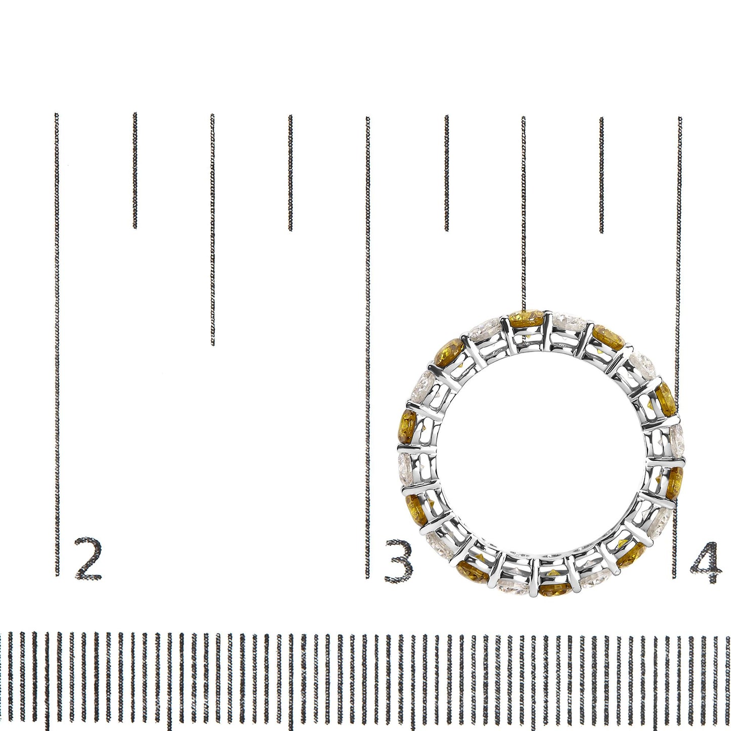 Top-down view of a white ring featuring alternating prong-set yellow and white round gemstones, placed on a ruler for size reference.