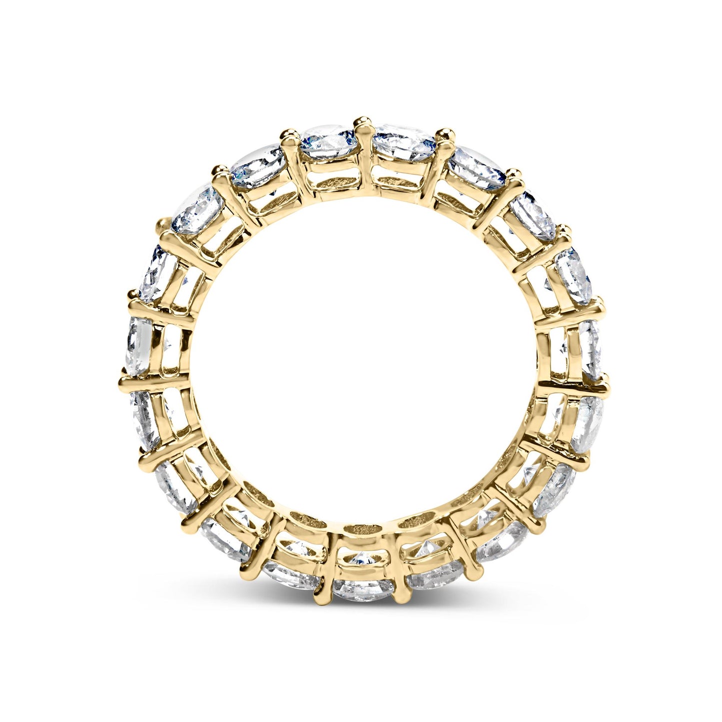 Top-down view of a yellow ring with round white gemstones set in a shared prong setting encircling the entire band.