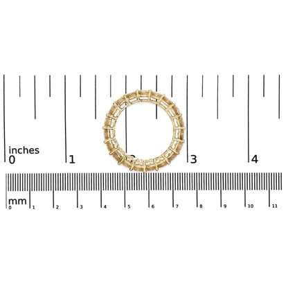 Ring with yellow metal band and round white gemstones set in shared prong setting, shown on a scale from top view.