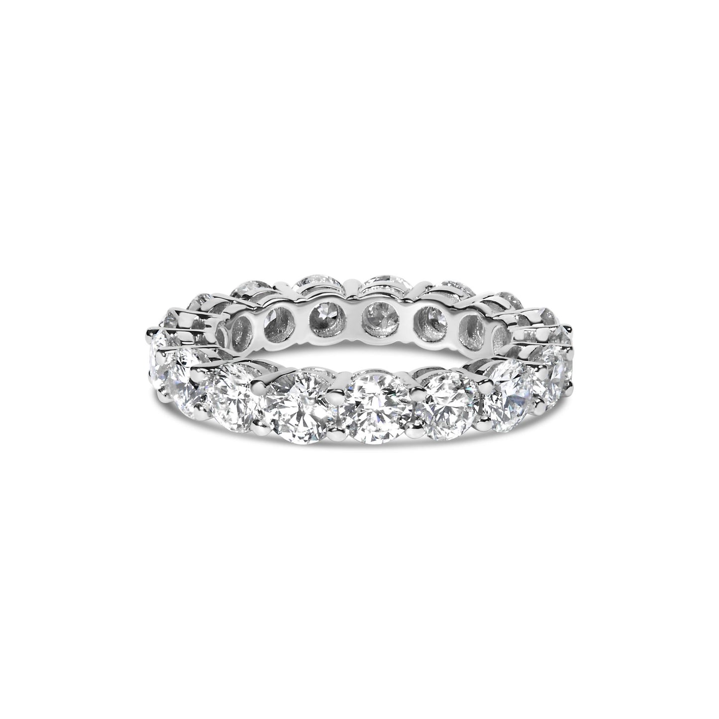 White metal ring viewed from front angle, featuring round white gemstones in shared prong setting encircling the band.
