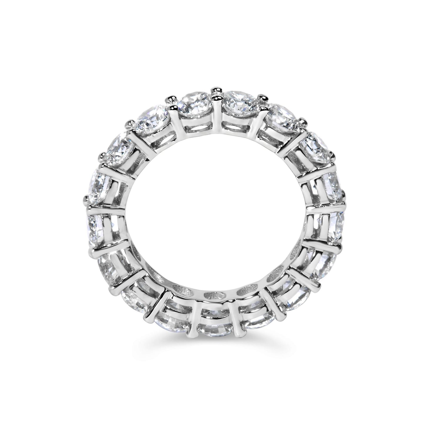 Top-down view of a white metal ring set with round white gemstones in a shared prong setting encircling the band.