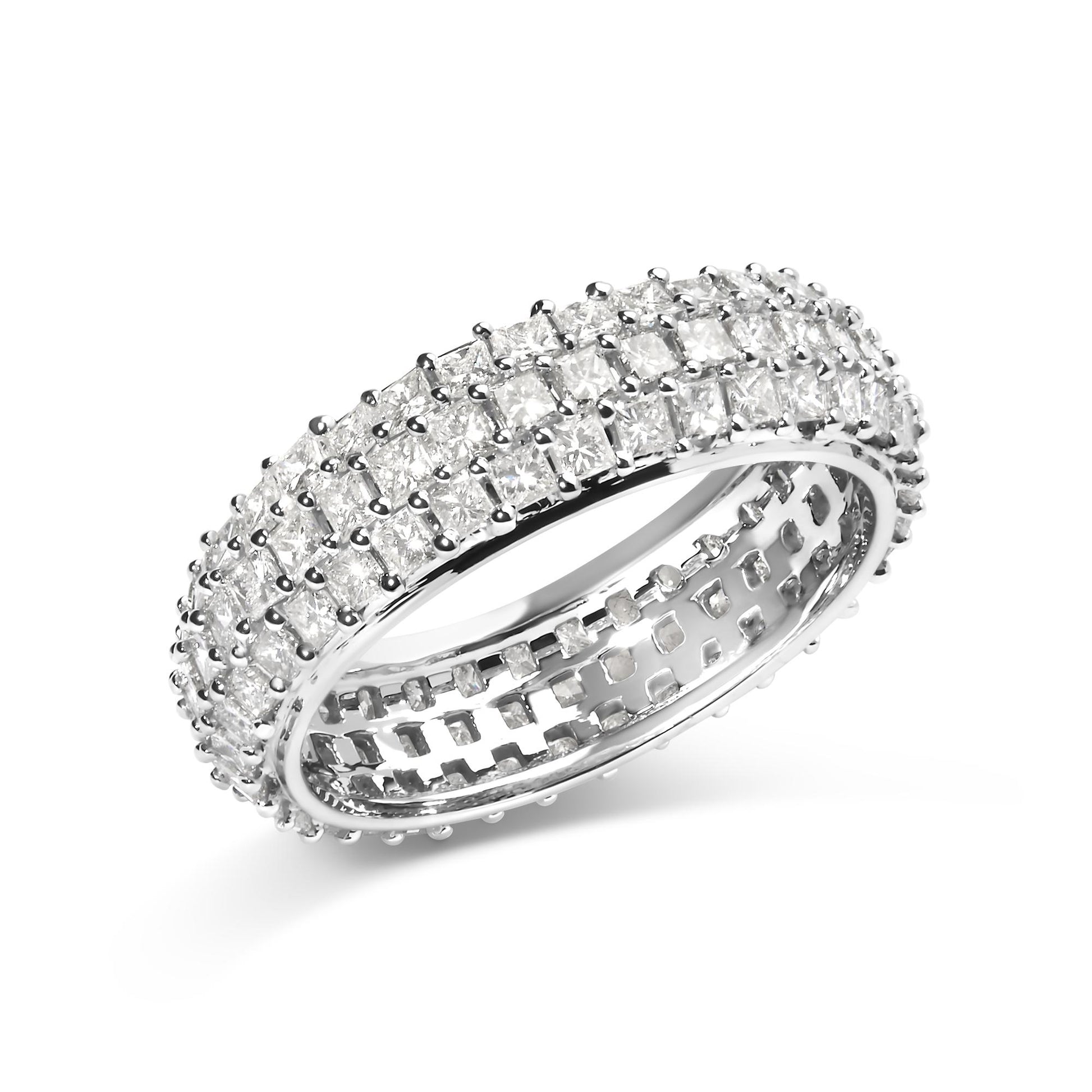 White ring shown at an angled close-up view, featuring three rows of princess-shaped white gemstones in prong settings encircling the band.