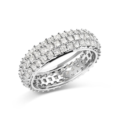 White ring shown at an angled close-up view, featuring three rows of princess-shaped white gemstones in prong settings encircling the band.