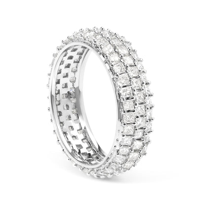 Close-up angled view of a white metal ring featuring three rows of square-shaped white gemstones in prong settings encircling the band.