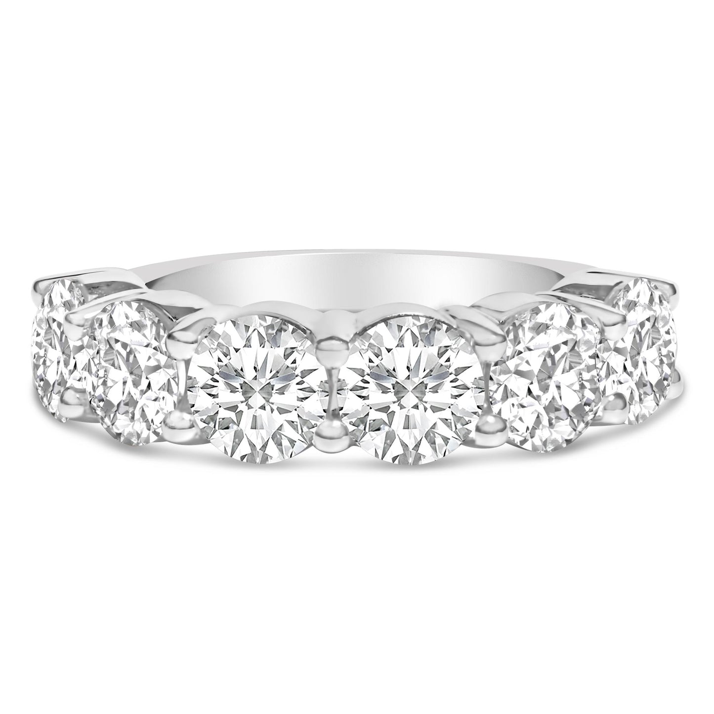 Close-up front view of a white ring featuring a row of round white gemstones set in a shared prong setting.