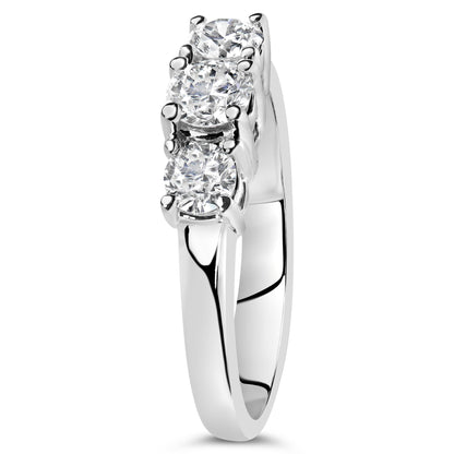 White metal ring with three round white gemstones in 4-prong settings, shown from a front side angle.