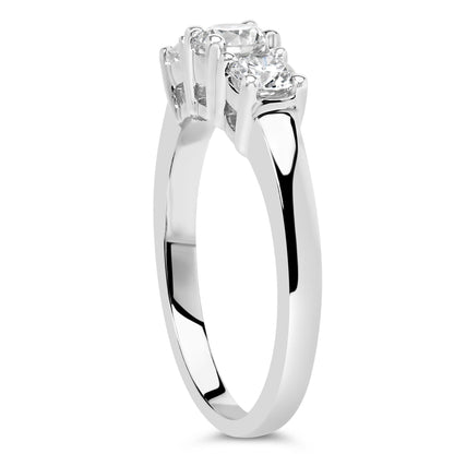 White metal ring with three round white gemstones in four-prong settings, shown at a side angle.