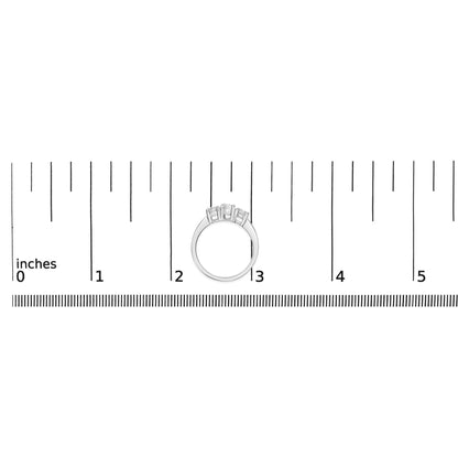 White metal ring with three round white gemstones in 4-prong settings, shown from the front on a ruler for size reference.