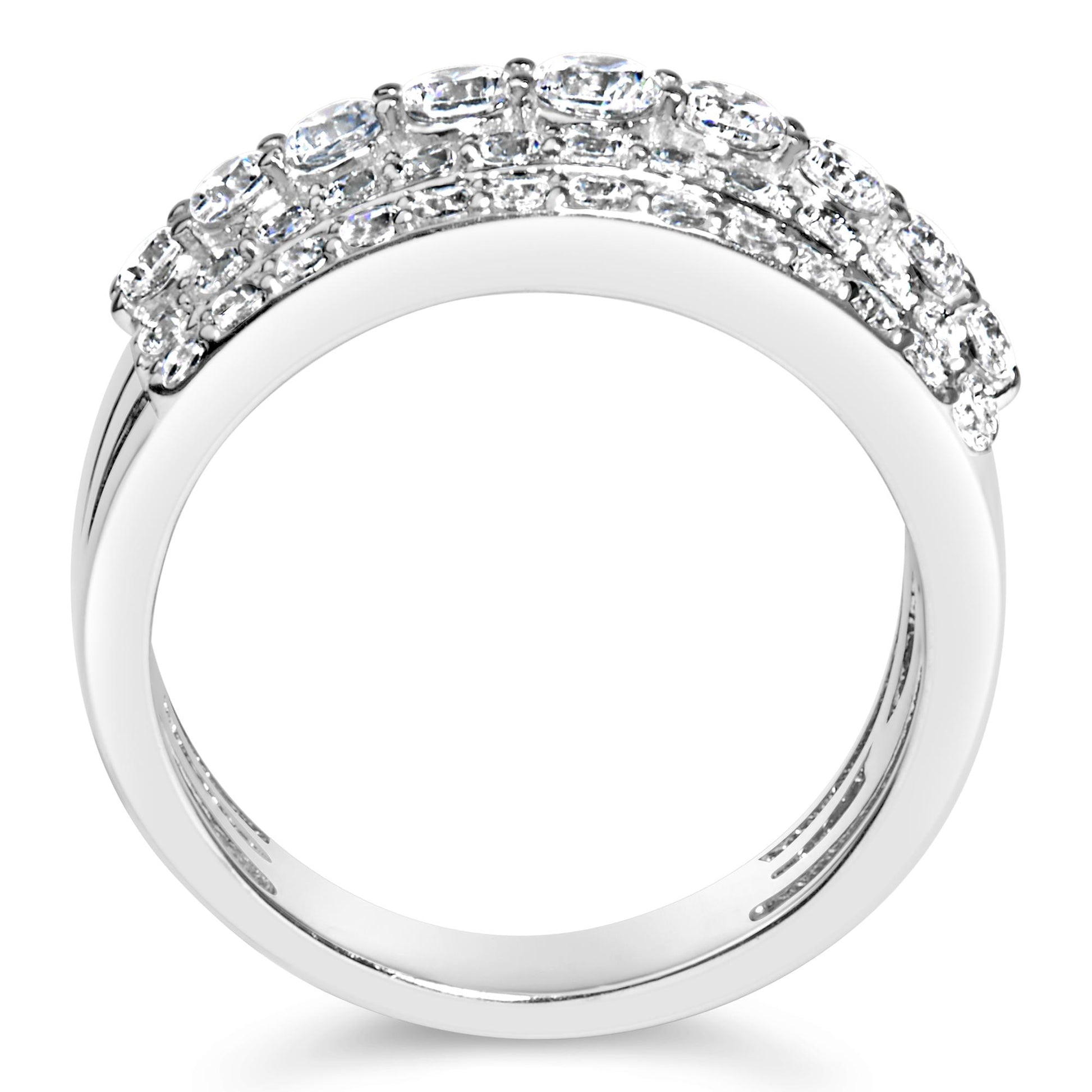 Close-up front angle of a white metal ring with multiple rows of round white gemstones in prong settings across the top.