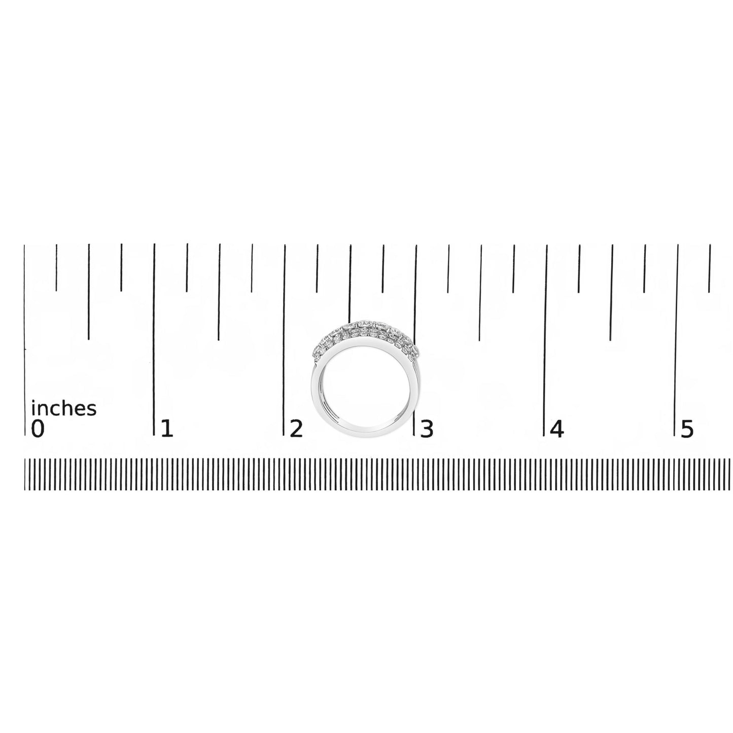 White metal ring with a gently curved band featuring multiple small white gemstones set in prongs, shown from above on a ruler scale.