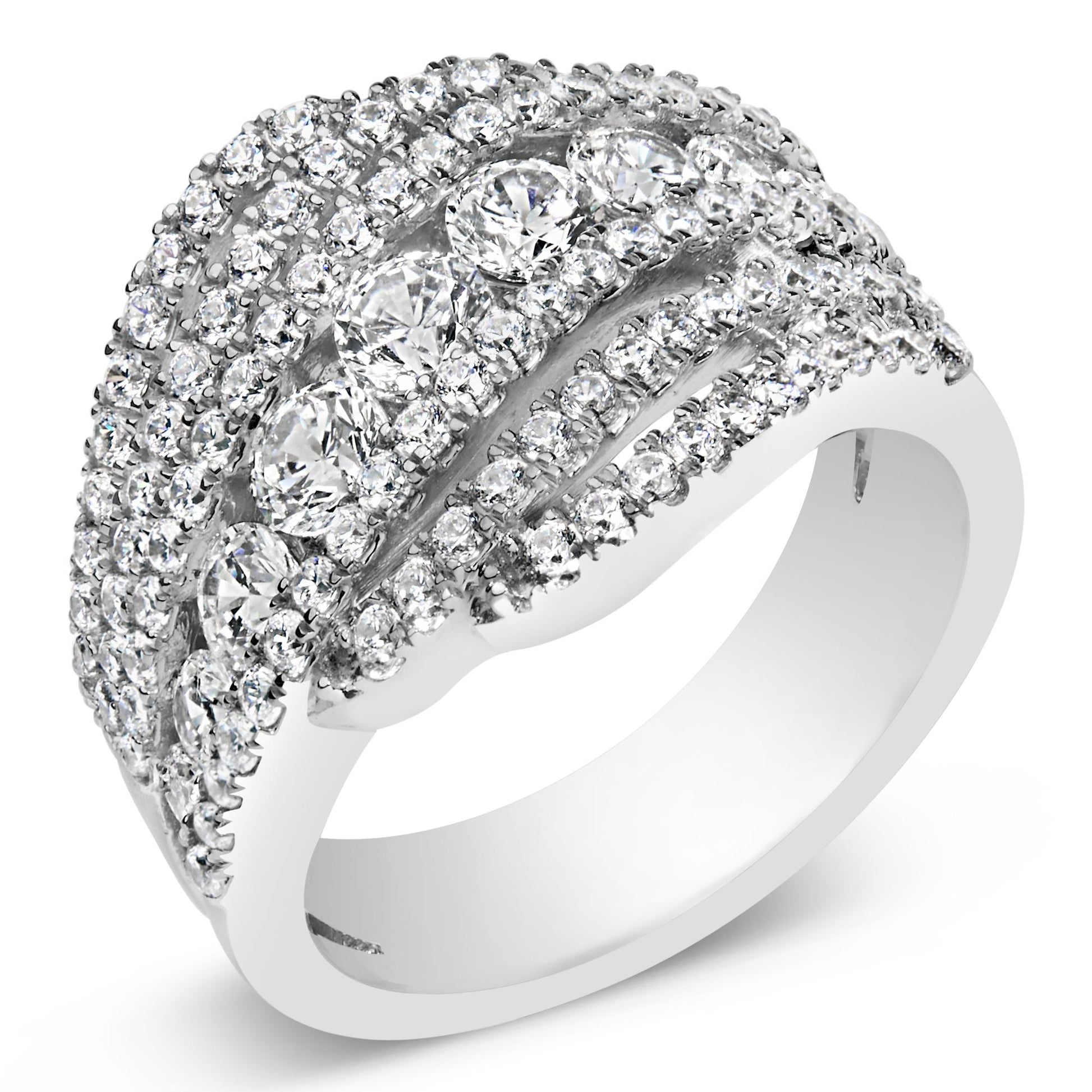 Close-up angled view of a white ring featuring multiple rows of round white gemstones in prong settings, including larger gemstones centrally placed and smaller ones surrounding them.