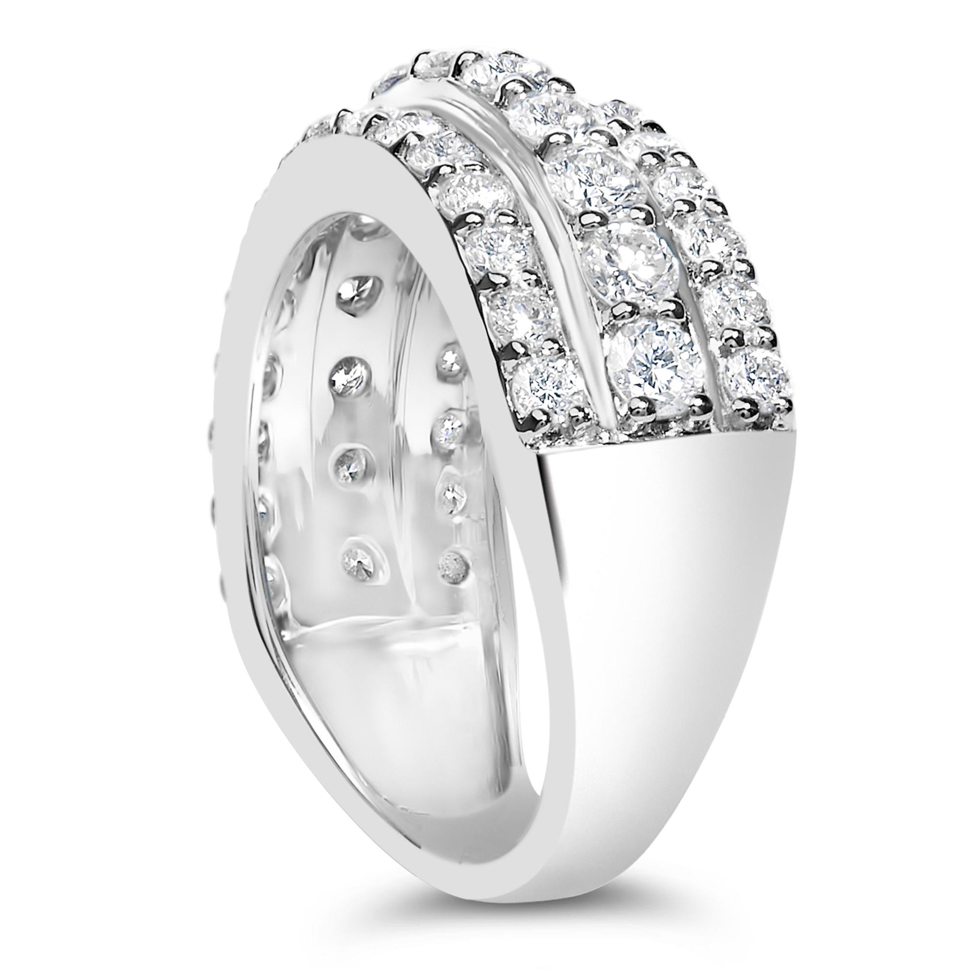Close-up angled view of a white ring featuring multiple rows of round white gemstones in prong settings on the top half.