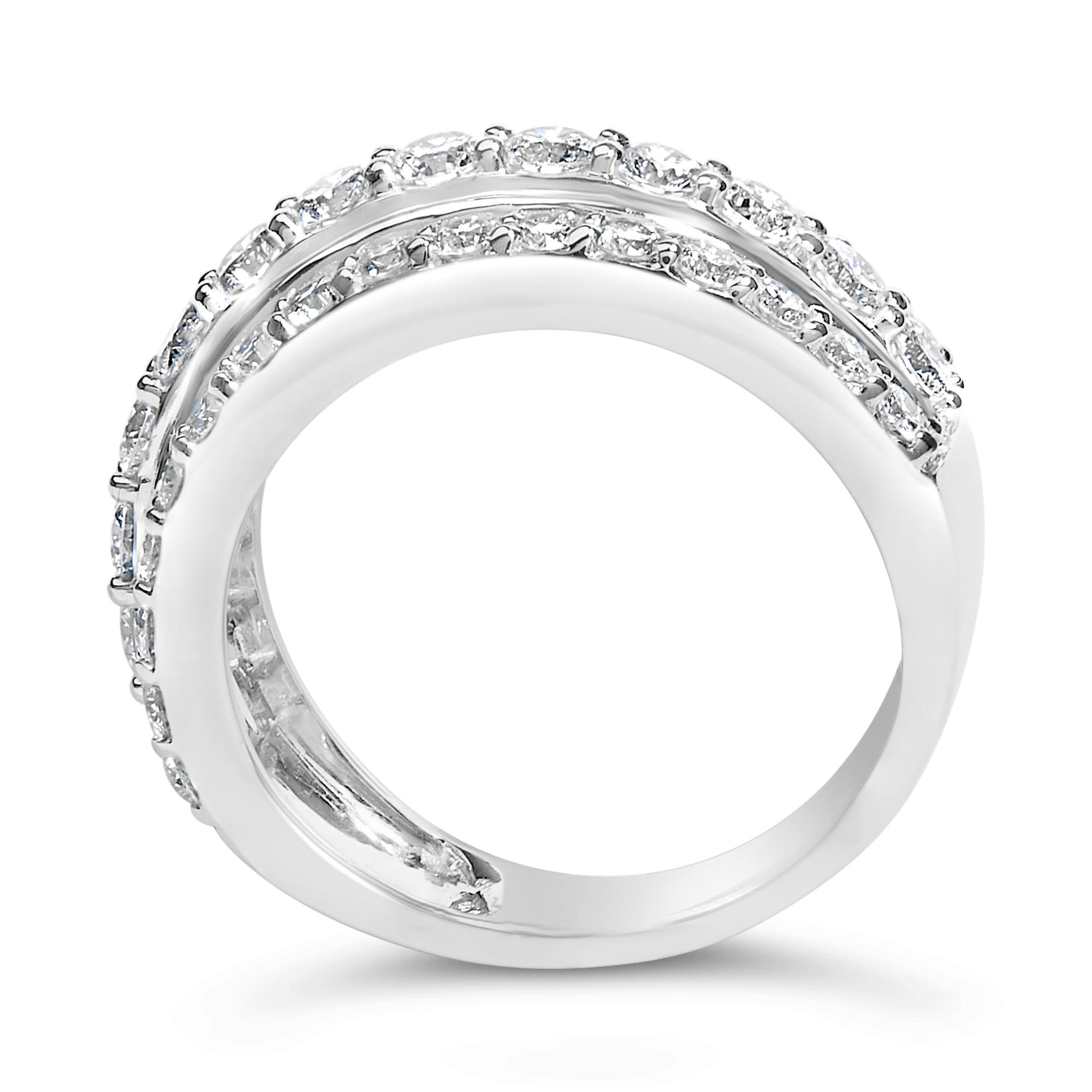 Close-up side view of a white metal ring featuring two rows of round white gemstones set in prongs along the band.