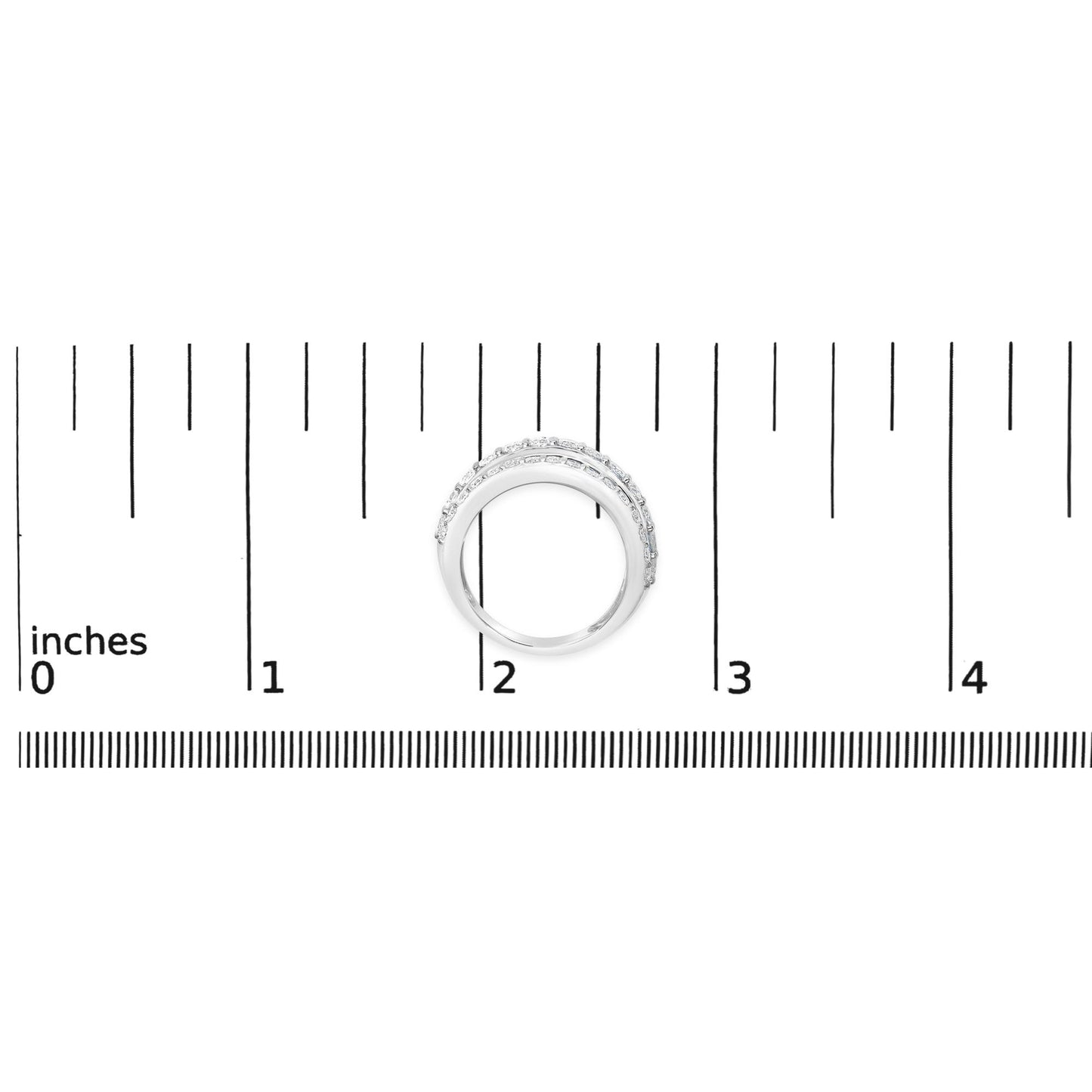 White ring with two rows of round white gemstones in prong settings, shown from above on a scale with inch measurements.