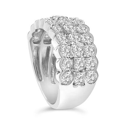 Close-up angled view of a white metal ring featuring two rows of white round gemstones set in prongs, with a scalloped edge design along one side.