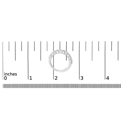 White metal ring with two rows of round white gemstones in prong settings, shown on a ruler for scale, top-down angle.