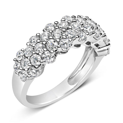 Close-up angled view of a white metal ring featuring multiple round white gemstones in prong settings arranged in a cluster pattern on the top half of the band.