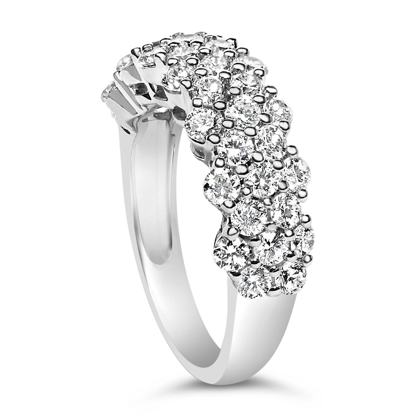 White metal ring with clusters of round white gemstones in prong settings, shown from a side angle.