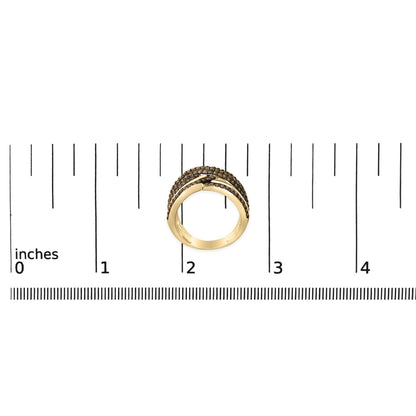Yellow metal ring with multiple bands set with champagne-colored round gemstones in prong settings, shown from the front on a scale.