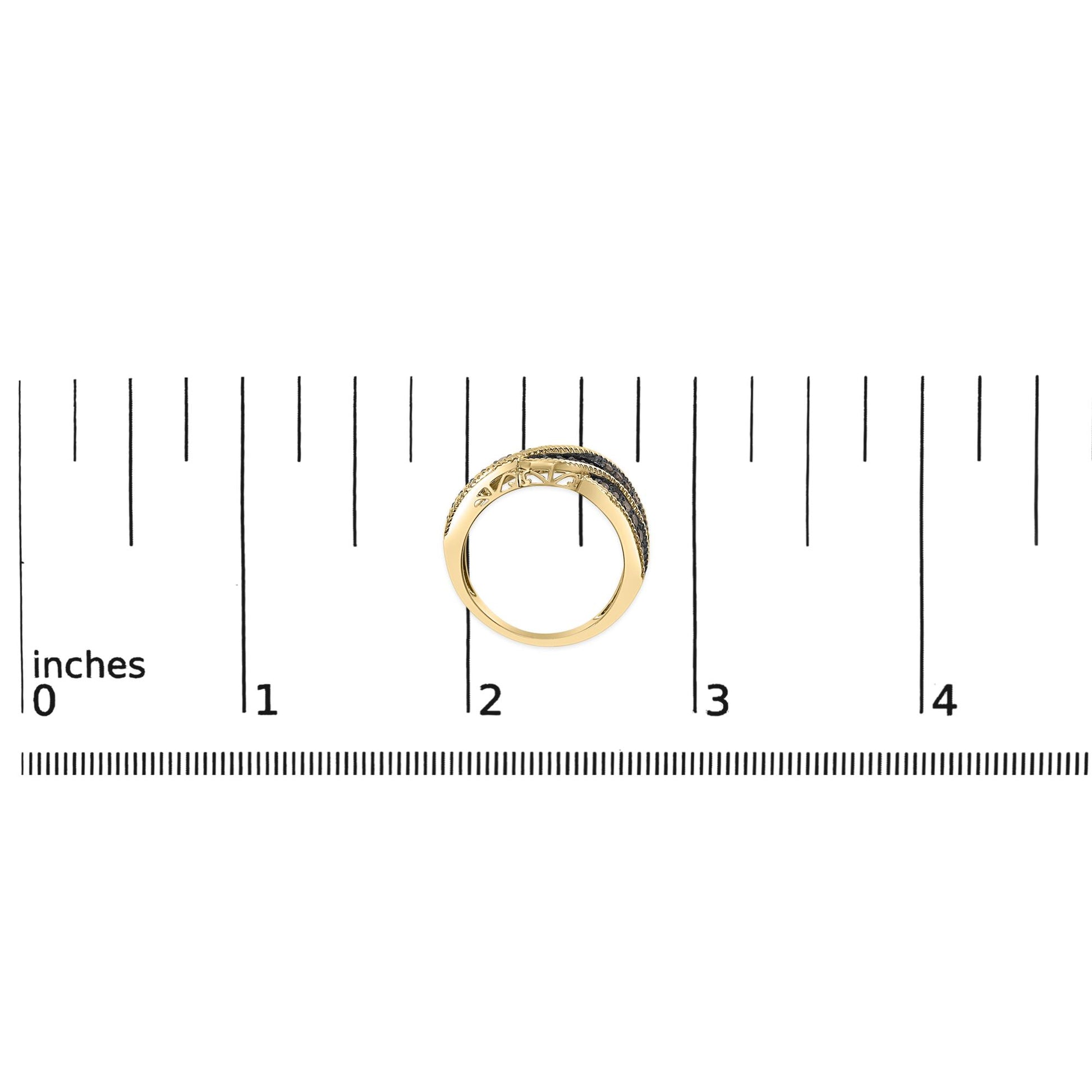 Ring with yellow metal band and multiple rows of round champagne-colored gemstones in prong settings, shown from the side angle on a ruler scale.