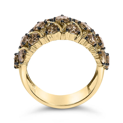 Close-up front angle of a yellow ring featuring two rows of round prong-set champagne-colored gemstones.