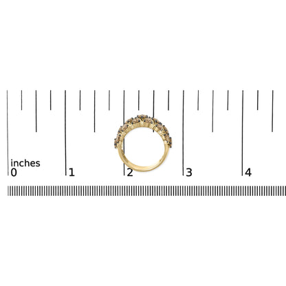 Yellow metal ring with two rows of round champagne-colored gemstones in prong settings, shown from the side on a scale.