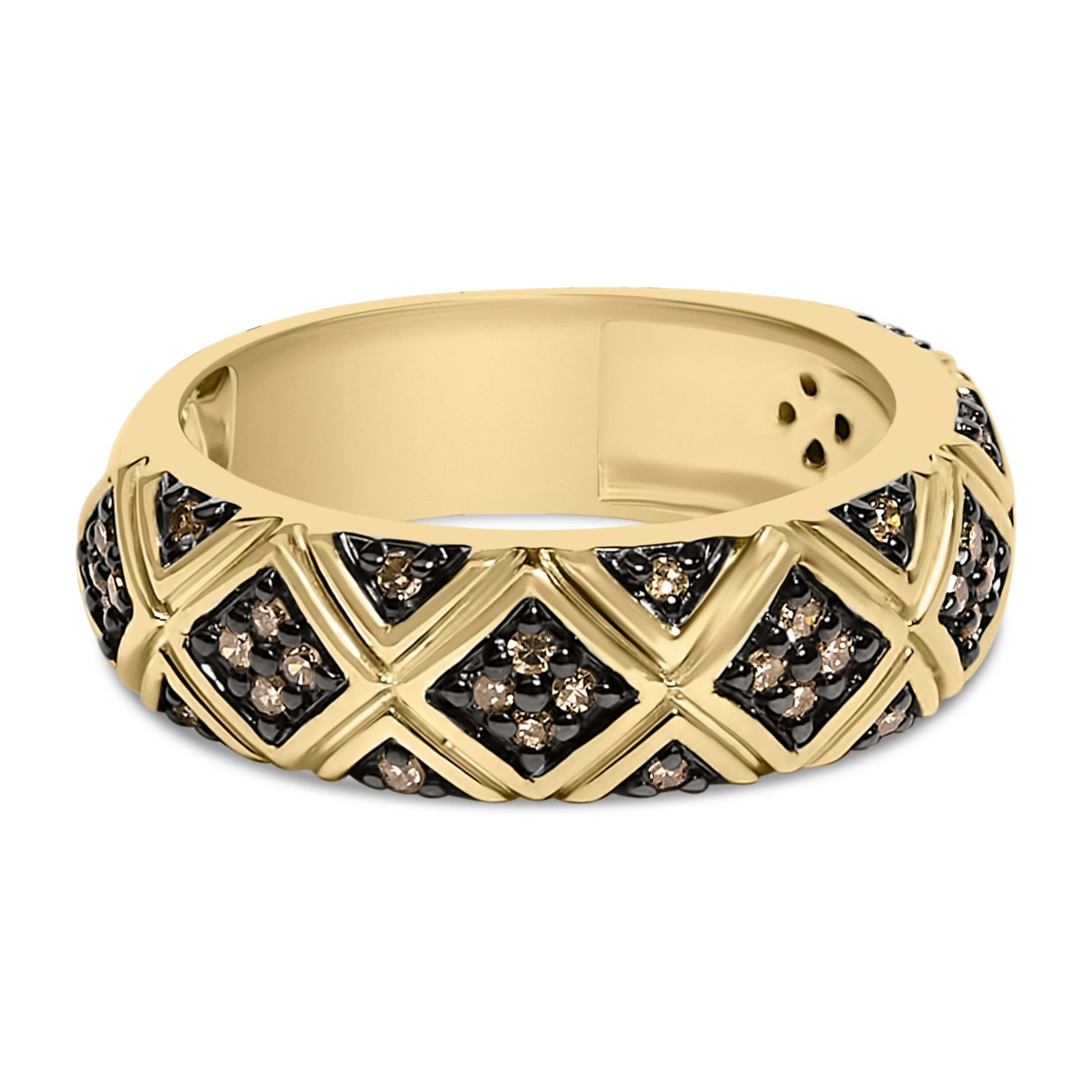 Yellow metal ring with a band design featuring crisscross patterns set with round champagne-colored gemstones in prong settings, shown from a side angle.