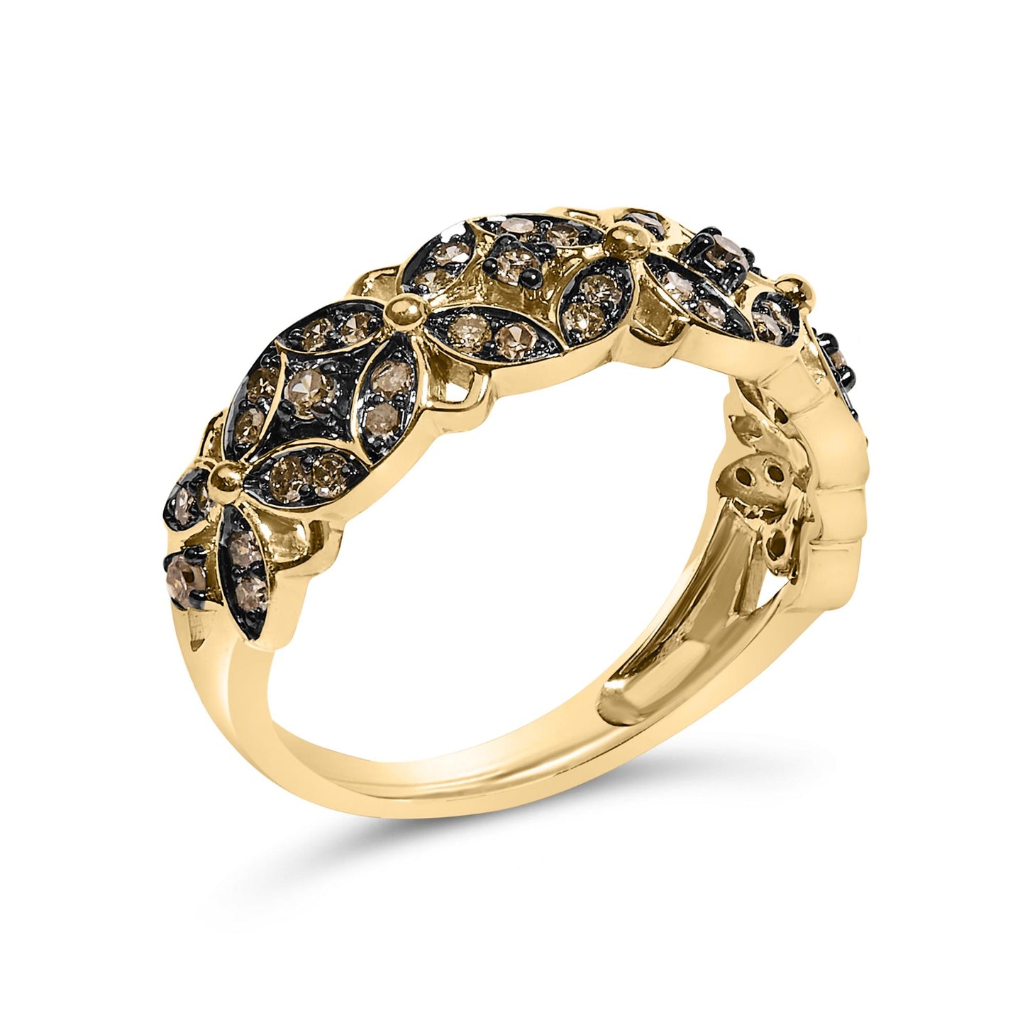 Yellow metal ring with a floral pattern featuring round champagne-colored gemstones in prong settings, shown in a close-up angled side view.