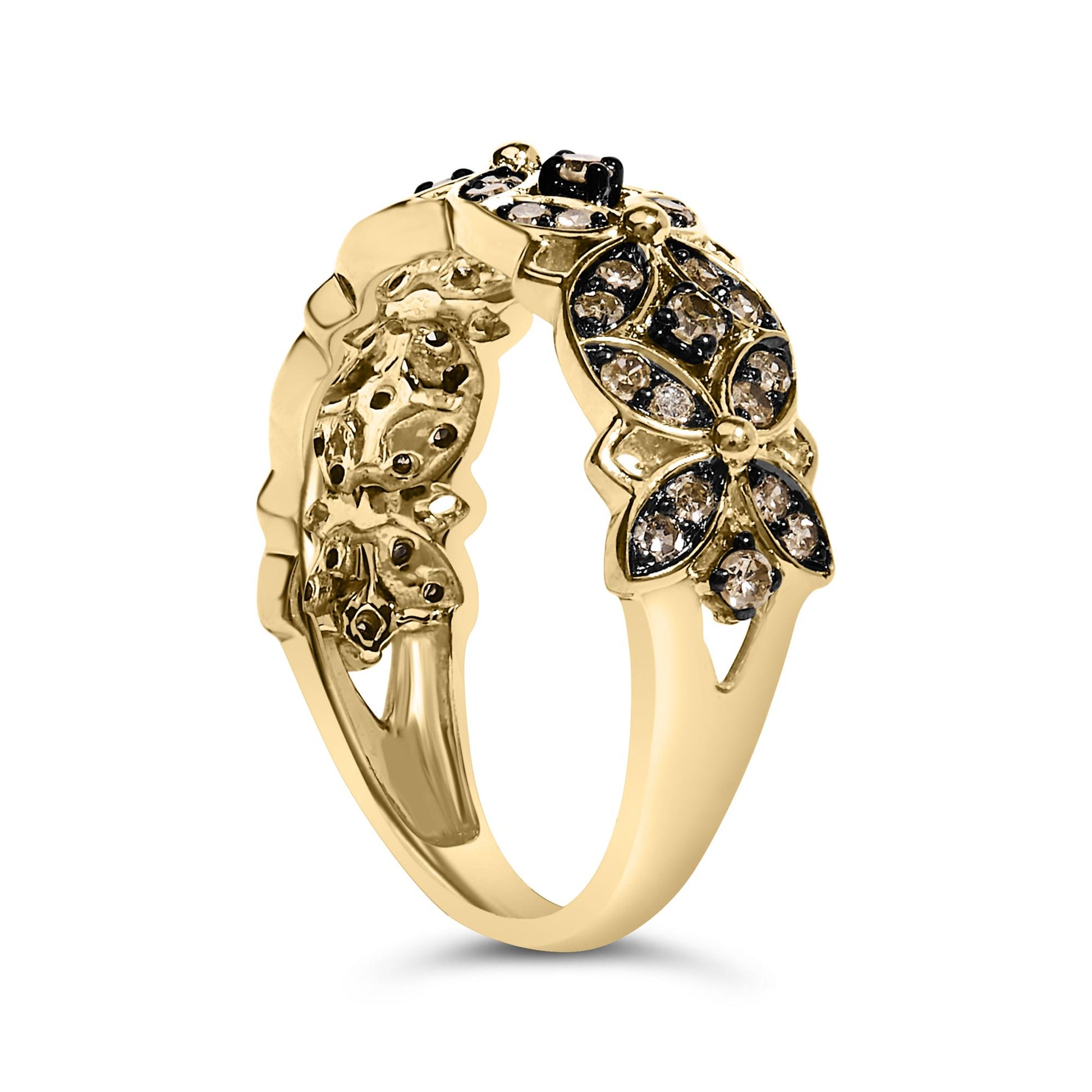 Yellow metal ring with floral design featuring round champagne-colored gemstones in prong settings, shown at an angled view.