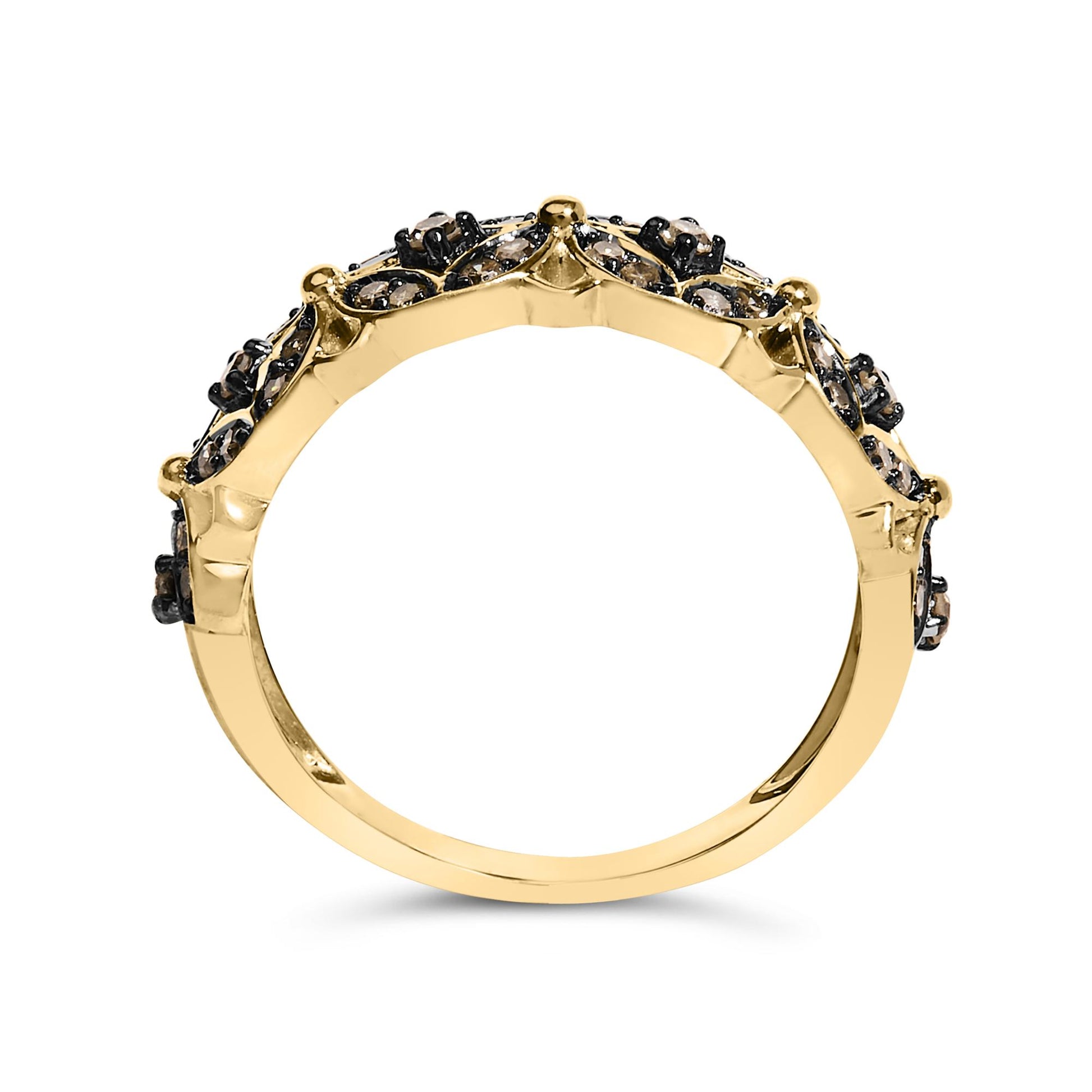 Yellow metal ring with round champagne-colored gemstones in prong settings, shown in a side profile angle on a white background.