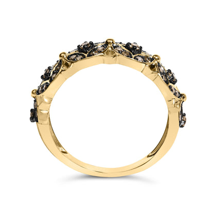 Yellow metal ring with round champagne-colored gemstones in prong settings, shown in a side profile angle on a white background.