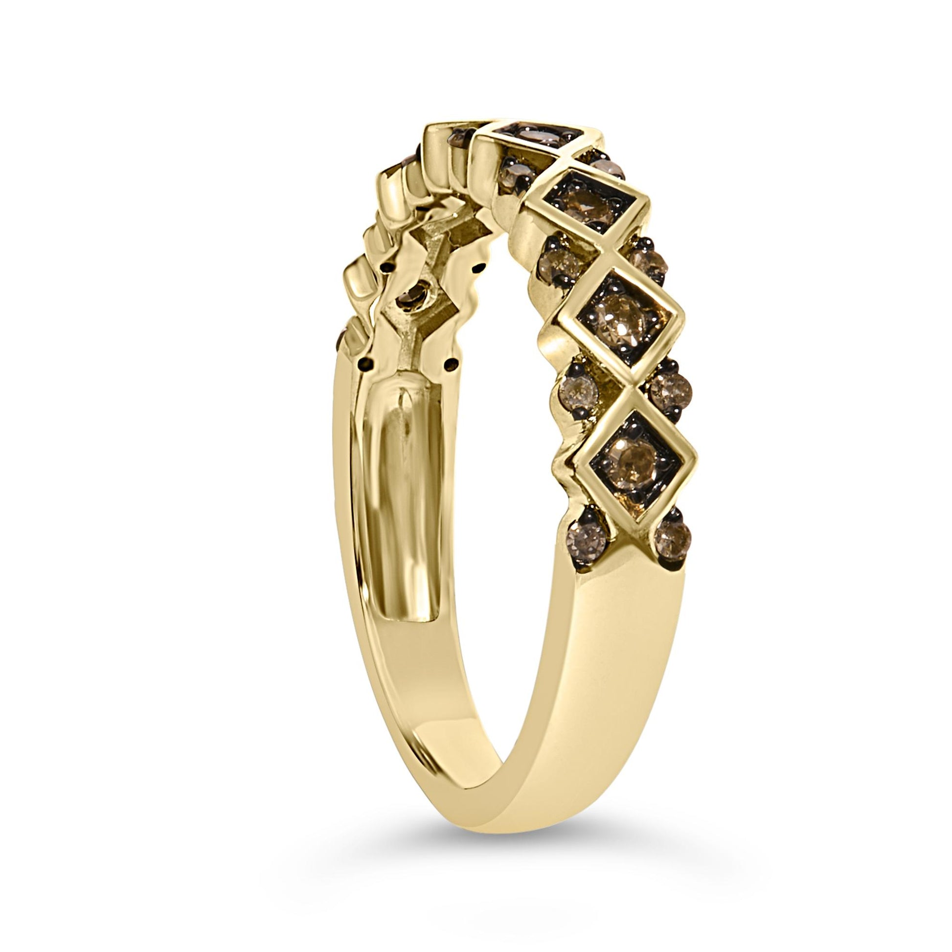 Close-up angled view of a yellow metal ring featuring alternating square settings with larger champagne-colored round gemstones surrounded by smaller champagne-colored round gemstones in prong settings.