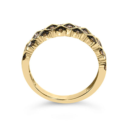 Close-up front profile shot of a yellow metal ring featuring round champagne-colored gemstones in prong settings arranged in a crisscross pattern along the band.