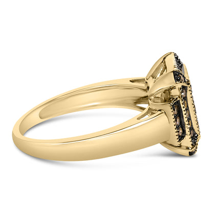 Side angle view of a yellow metal ring with prong-set round champagne-colored gemstones on the top.