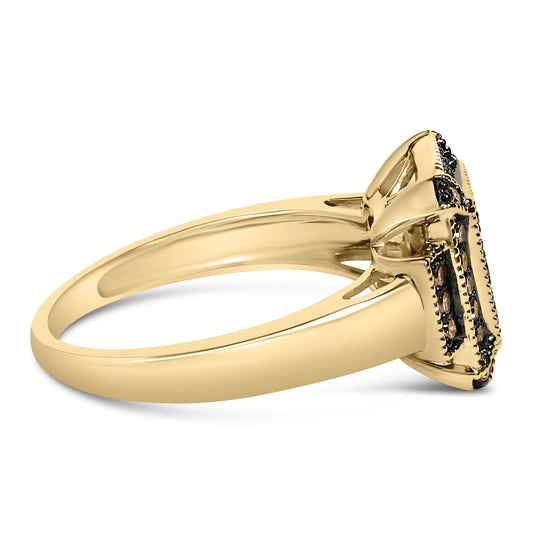 Side angle view of a yellow metal ring with prong-set round champagne-colored gemstones on the top.
