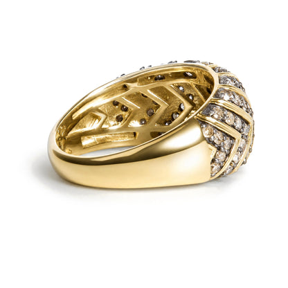 Close-up angled view of a yellow metal ring with round prong-set champagne-colored gemstones arranged in multiple rows on the upper surface.