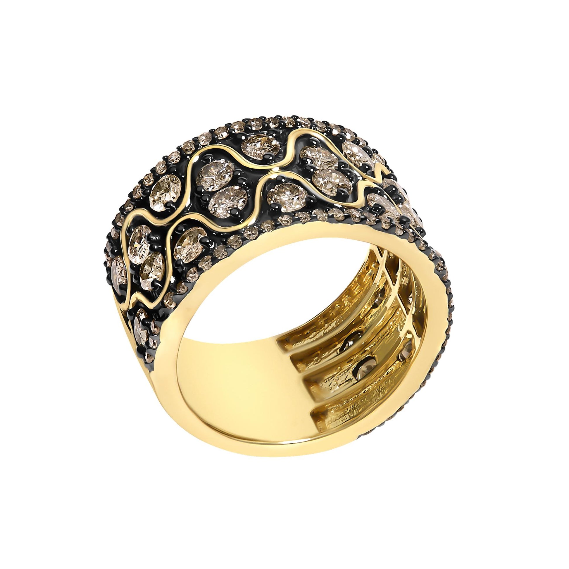 Close-up angled view of a yellow metal ring with an intricate openwork design, featuring two rows of round champagne-colored gemstones set in prongs along the edges and larger round champagne-colored gemstones set in prongs in a wavy pattern across the central section.