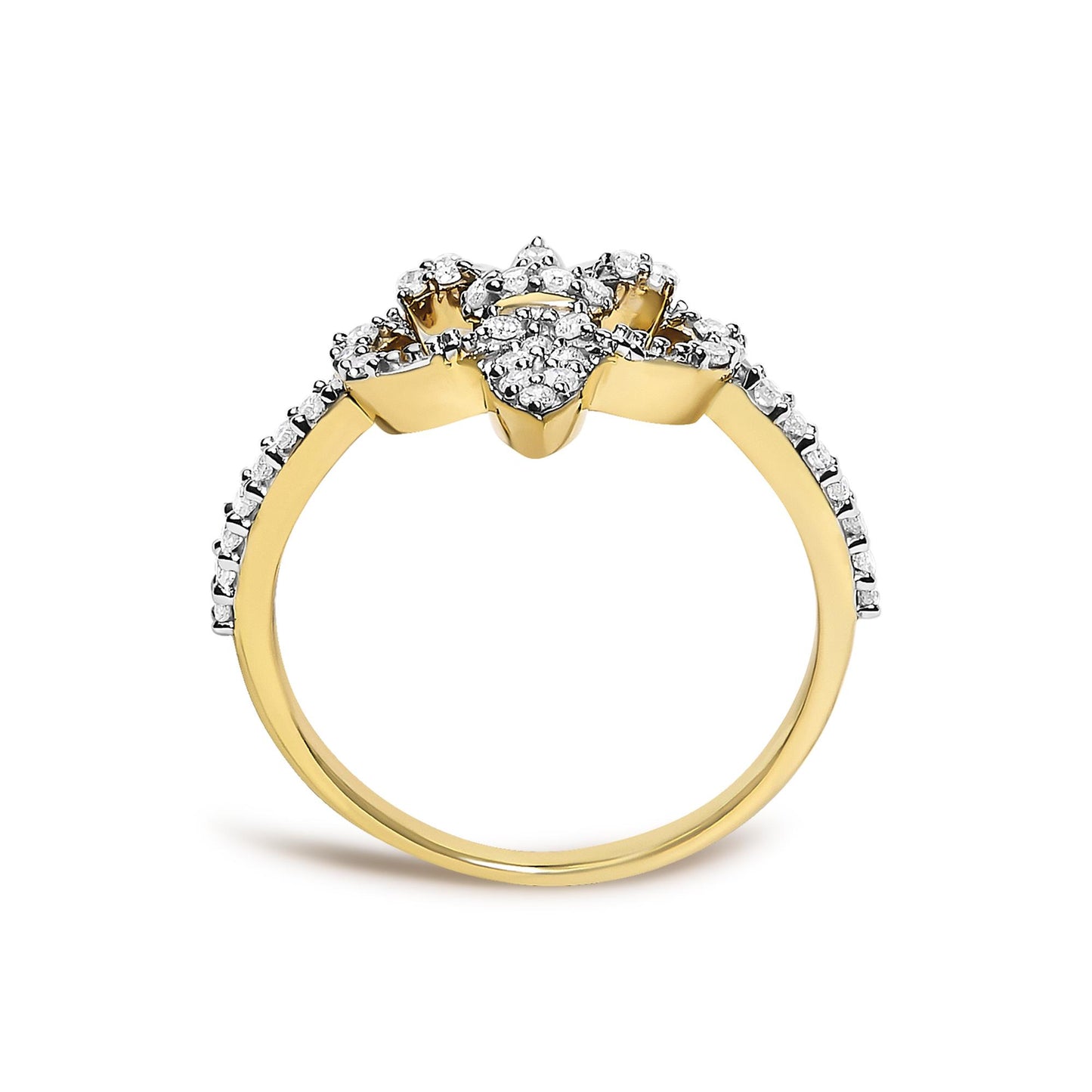 Close-up front view of a yellow ring with round white gemstones in prong settings along the band and cluster on top.