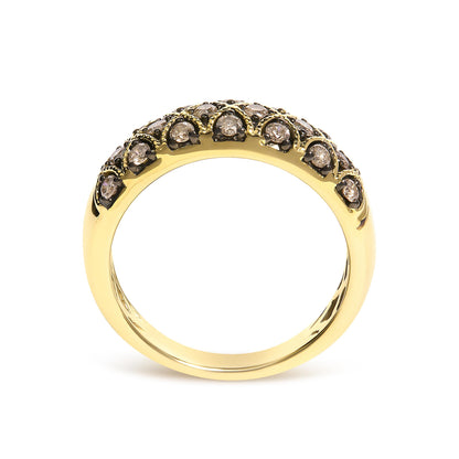 Close-up front view of a yellow ring featuring round champagne-colored gemstones set in prong settings along the band.