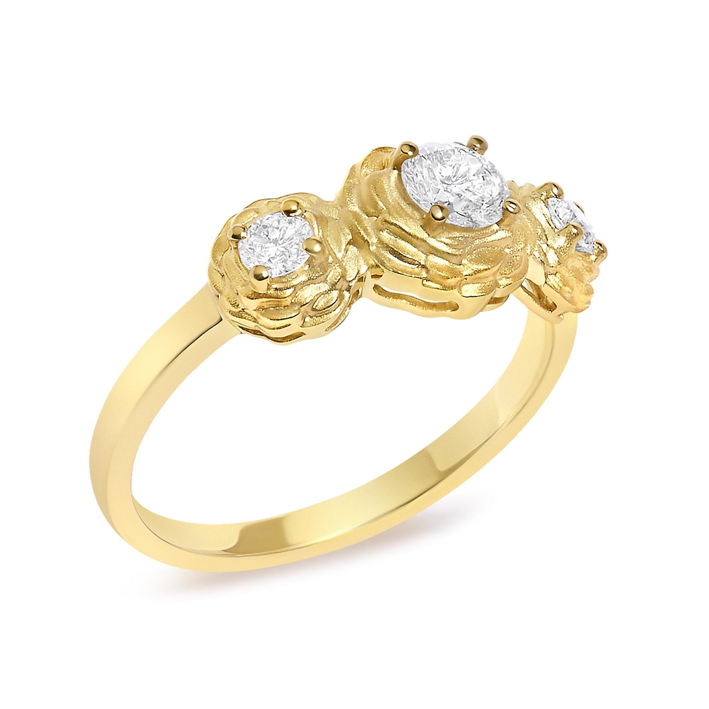 Close-up angled view of a yellow metal ring with three round white gemstones in prong settings, featuring a textured flower-like design around each gemstone.